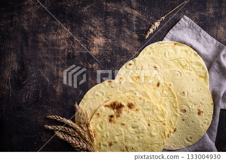 Lavash flat bread on green background 133004930
