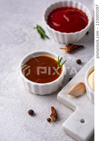 Set of different sauces. Ketchup, mustard, pesto 133005097