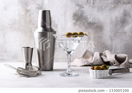 Traditional martini cocktail with olives and Traditional martini cocktail with olives and 133005100