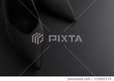 Black Friday Fashion: Elegant Black Shoes with Bows on Black Background Black Friday Fashion: Elegant Black Shoes with Bows on Black Background 133005274