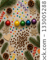Festive Christmas Pride Flat Lay with Rainbow Ornaments, Pinecones, and Candles 133005288
