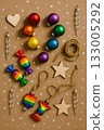 Festive Christmas Pride Flat Lay with Rainbow Ornaments, Pinecones, and Candles 133005292