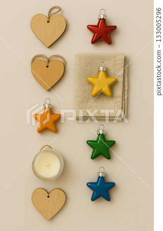 Festive Christmas Pride Flat Lay with Rainbow Ornaments, Pinecones, and Candles 133005296