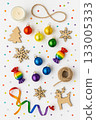 Festive Christmas Pride Flat Lay with Rainbow Ornaments, Pinecones, and Candles 133005333
