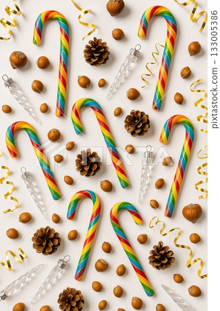 Festive Christmas Pride Flat Lay with Rainbow Ornaments, Pinecones, and Candles 133005386