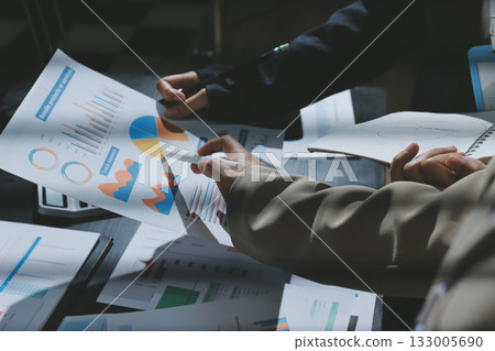 Close up high angle Asian businesswoman working with her coworker in meeting room Close up high angle Asian businesswoman working with her coworker in meeting room 133005690