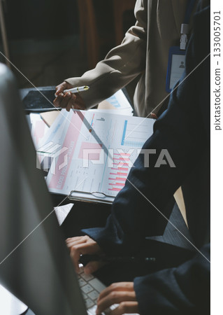 Close up high angle Asian businesswoman working with her coworker in meeting room Close up high angle Asian businesswoman working with her coworker in meeting room 133005701