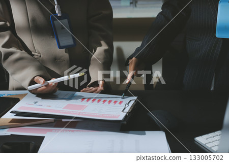 Close up high angle Asian businesswoman working with her coworker in meeting room 133005702