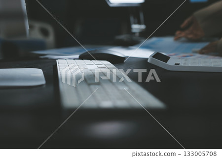 Close up high angle Asian businesswoman working with her coworker in meeting room 133005708