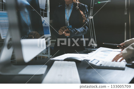 Close up high angle Asian businesswoman working with her coworker in meeting room Close up high angle Asian businesswoman working with her coworker in meeting room 133005709