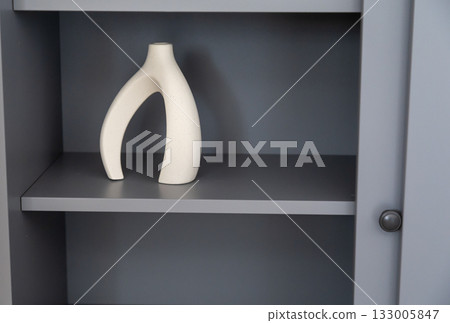 Artistic ceramic vase with sculptural form. Contemporary aesthetics, simplicity, and organic modern home style. Artistic ceramic vase with sculptural form. Contemporary aesthetics, simplicity, and organic modern home style. 133005847