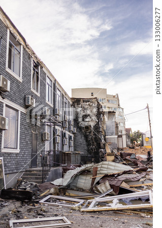 Bila Tserkva, Kyiv region, Ukraine - 09.06.2025: A hospital and a recreation center were destroyed. Charred wall with AC units and debris aftermath of urban fire damage. Bila Tserkva, Kyiv region, Ukraine - 09.06.2025: A hospital and a recreation center were destroyed. Charred wall with AC units and debris aftermath of urban fire damage. 133006277