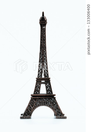 Small Eiffel Tower model showcases intricate design. High quality photo 133006400