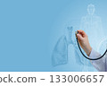 Doctor examines lungs. 133006657