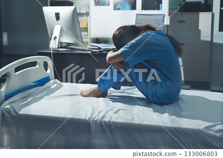 A patient with depression looks outside. A patient with depression looks outside. 133006803