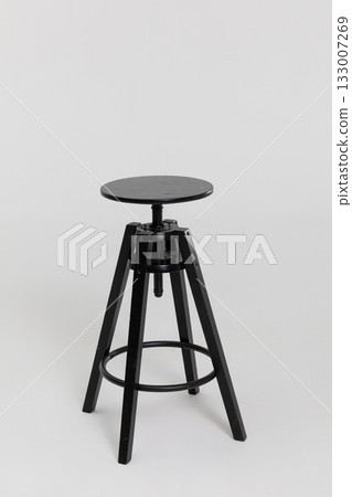 This stylish black adjustable bar stool features a modern and elegant design suitable for any space 133007269