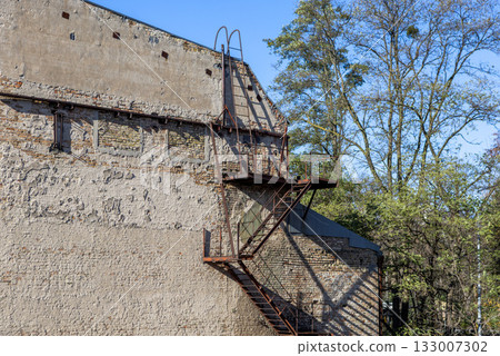 Wall of an old house with an iron staircase Wall of an old house with an iron staircase 133007302