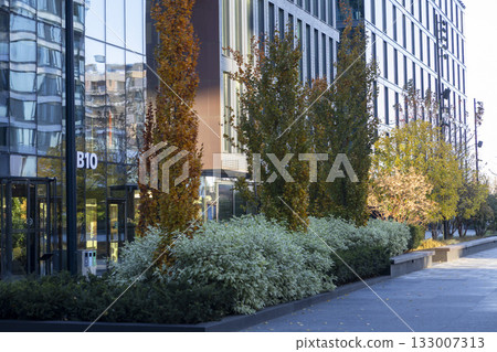 A modern business center with a glass facade and contemporary architecture 133007313