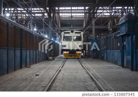 An electric train at a train construction and repair plant An electric train at a train construction and repair plant 133007345