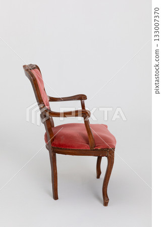 This is an Elegant Side Chair that features a Sturdy Wooden Frame and Luxurious Red Upholstery 133007370