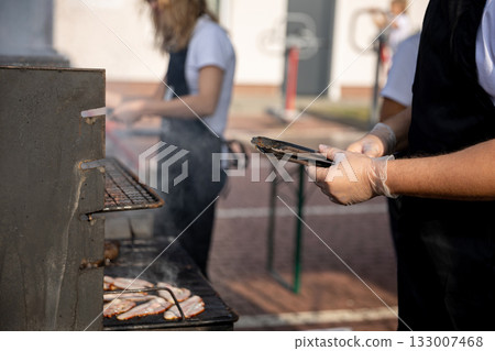 Engaging in Outdoor Barbecue Cooking which centers around Grilled Meat is a delightful experience Engaging in Outdoor Barbecue Cooking which centers around Grilled Meat is a delightful experience 133007468