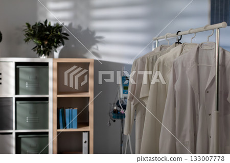 Maintain a Clean Medical Environment featuring Hospital Gowns and a Functional Shelving Unit Maintain a Clean Medical Environment featuring Hospital Gowns and a Functional Shelving Unit 133007778