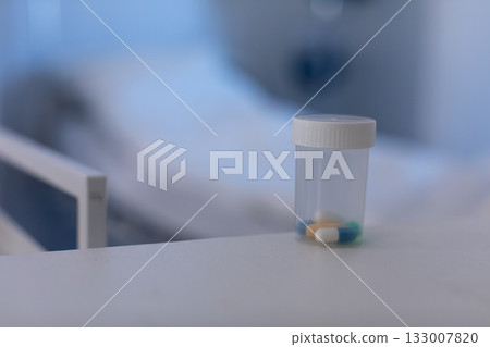 A closeup view featuring multiple prescription medication bottles positioned neatly on a table A closeup view featuring multiple prescription medication bottles positioned neatly on a table 133007820