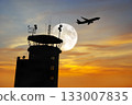 Air Traffic Control Tower at Airport As Airplane Takes Off. 133007835