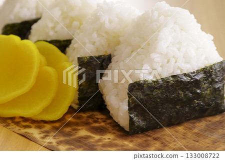 Rice balls and pickled radish wrapped in bamboo skin Rice balls and pickled radish wrapped in bamboo skin 133008722
