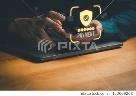 Person using smartphone for secure online payment with shield, check mark and password protection symbol, representing mobile banking, fintech security, digital transaction and safe e-commerce. Person using smartphone for secure online payment with shield, check mark and password protection symbol, representing mobile banking, fintech security, digital transaction and safe e-commerce. 133009268