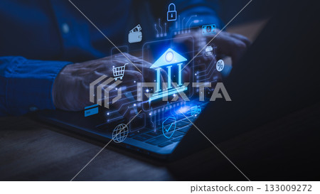 Person using laptop with glowing digital banking icons, symbolizing online banking, financial technology, secure transactions, e-commerce, mobile payments, fintech, and digital finance innovation. Person using laptop with glowing digital banking icons, symbolizing online banking, financial technology, secure transactions, e-commerce, mobile payments, fintech, and digital finance innovation. 133009272
