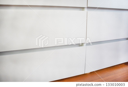 White dresser drawer fronts close up minimal interior White dresser drawer fronts close up minimal interior 133010003