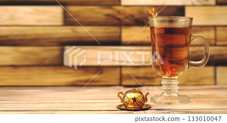 Cup of tea and teapot on wooden table. High quality photo Cup of tea and teapot on wooden table. High quality photo 133010047
