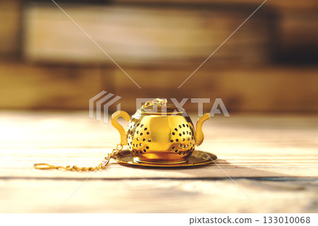 Tea Brewing Strainer on Wooden Table. High quality photo 133010068