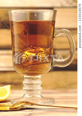 Cup of Cinnamon Lemon Tea on Wooden Table. High quality photo Cup of Cinnamon Lemon Tea on Wooden Table. High quality photo 133010079
