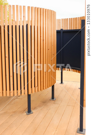 Beach changing cabin with wooden slats modern pavilion vertical composition 133010976