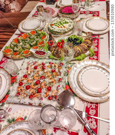 Festive home dinner table with caviar and shrimp elegant table setting vertical frame 133010980