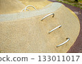 Play hill with metal climbing arches, safe rubber surfacing in park 133011017