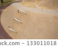 Play hill with metal climbing arches, safe rubber surfacing in park 133011018