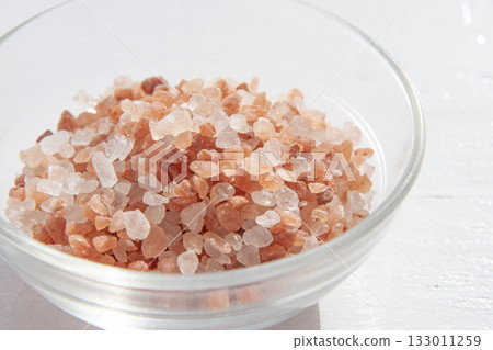 Pink rock salt in a glass container Pink rock salt in a glass container 133011259