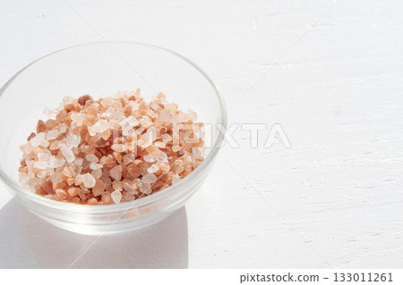 Pink rock salt in a glass container Pink rock salt in a glass container 133011261