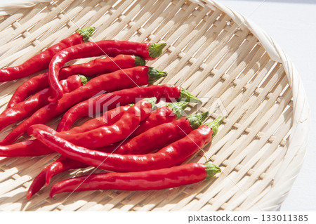 Chili peppers drying on a windowsill in winter Chili peppers drying on a windowsill in winter 133011385