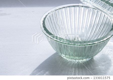 Glass container on the windowsill Glass container on the windowsill 133011575