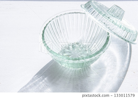Glass container on the windowsill Glass container on the windowsill 133011579