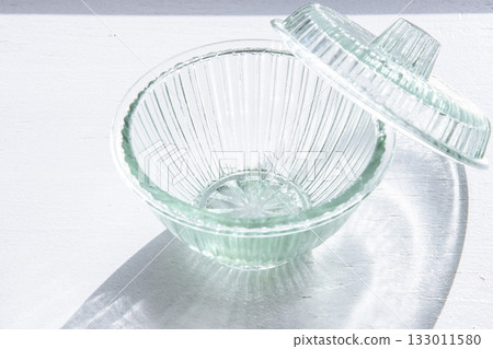 Glass container on the windowsill Glass container on the windowsill 133011580