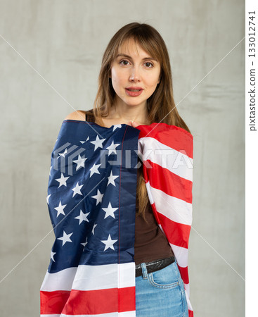 Portrait of positive young woman with flag of USA Portrait of positive young woman with flag of USA 133012741