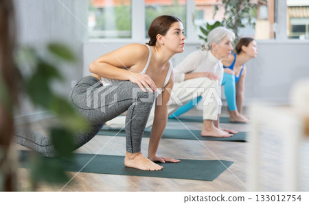 Young woman doing fitness in fitness studio Young woman doing fitness in fitness studio 133012754
