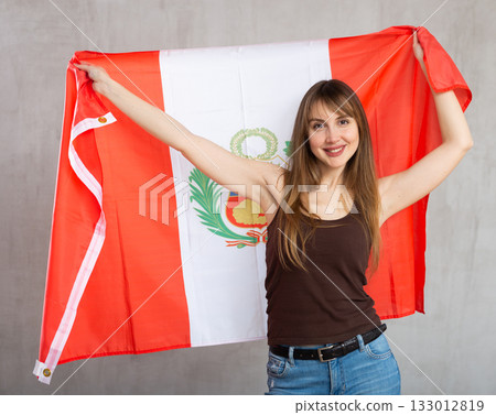 Positive girl with Peru flag rooting for your favorite team 133012819