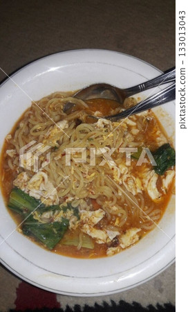 Delicious Indomie kuah with rich, savory broth and springy noodles, creating a warm and comforting meal. Perfect for a quick, satisfying dish with bold flavors and aromatic spices! Delicious Indomie kuah with rich, savory broth and springy noodles, creating a warm and comforting meal. Perfect for a quick, satisfying dish with bold flavors and aromatic spices! 133013043