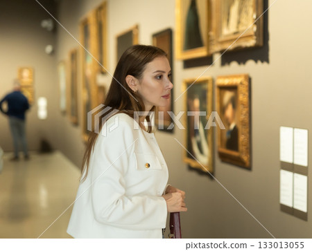 Girl view pictures and icons in museum hall Girl view pictures and icons in museum hall 133013055